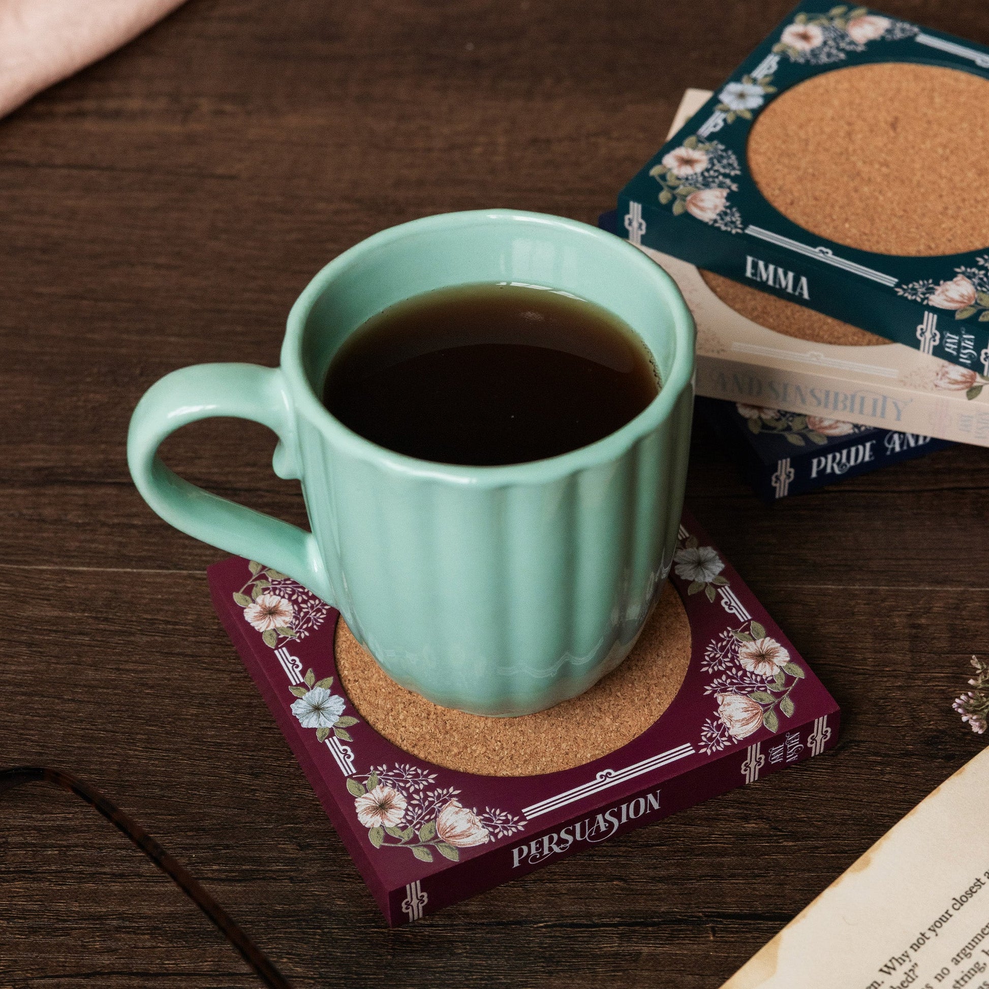 Book coasters showing Jane Austen novel titles along the spines
