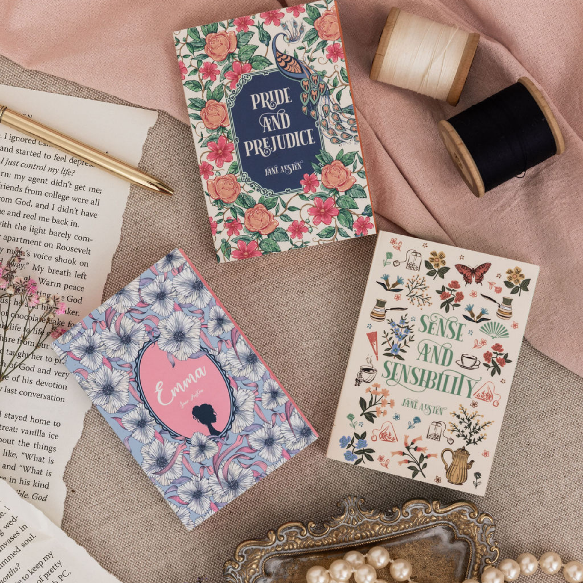 Three mini book notepads flat lay showing Austen cover designs