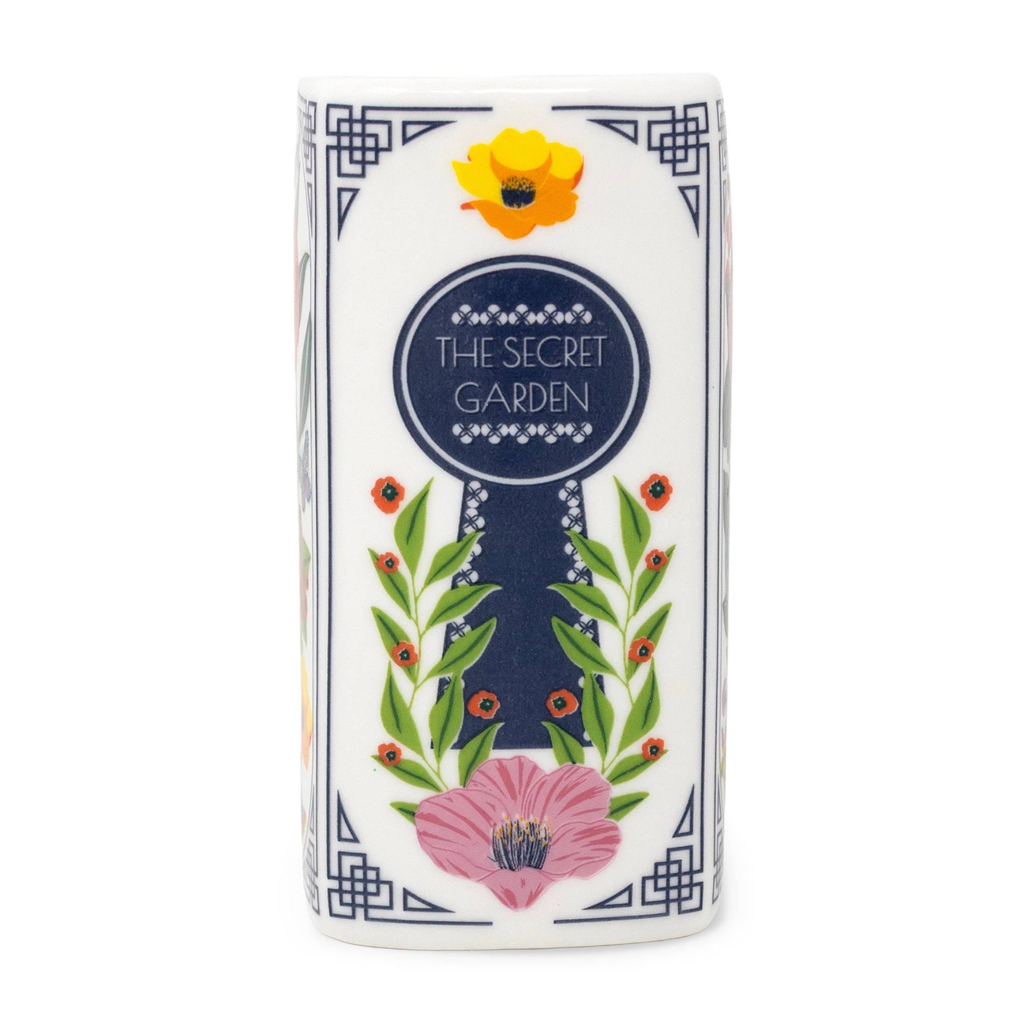 Spine of the Secret Garden book candle with keyhole design, white background