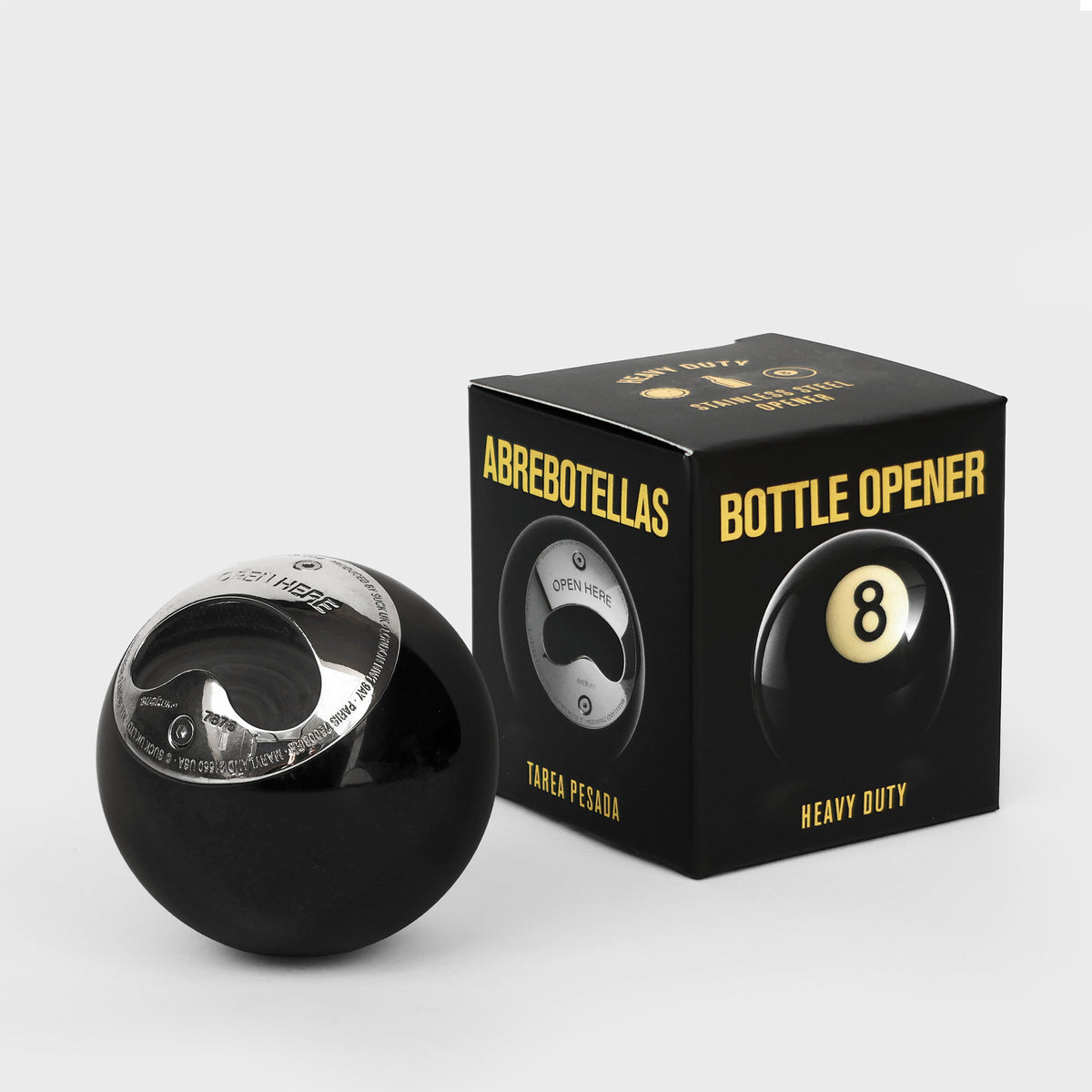 8 ball bottle opener beside its black and gold gift box