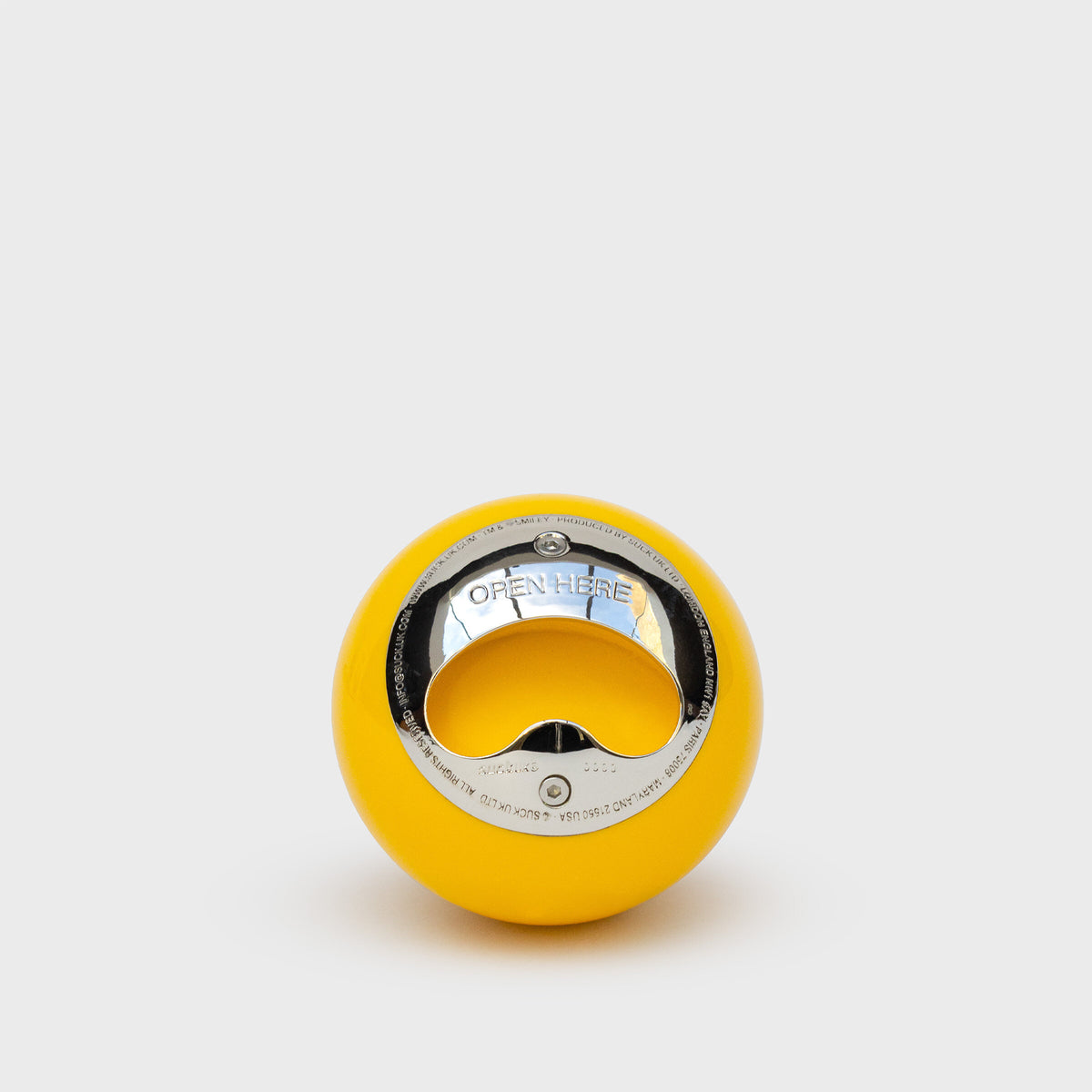 Polished steel opener insert in the back of the yellow Smiley ball