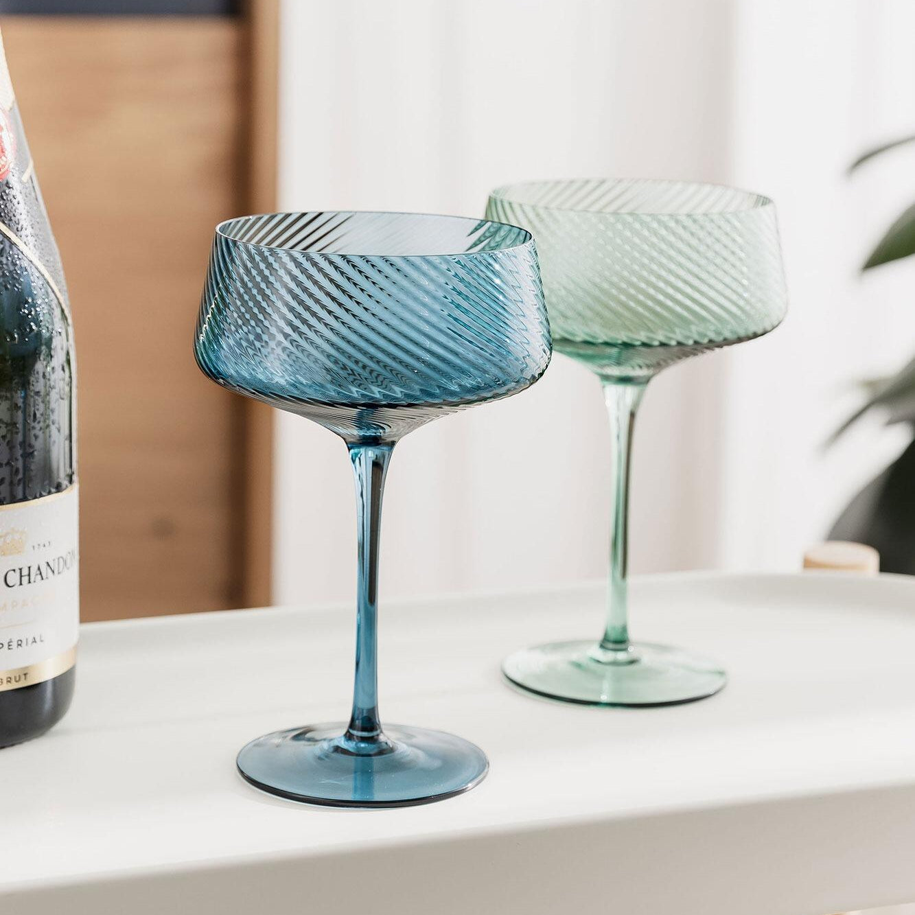 Twist champagne coupes in a styled setting