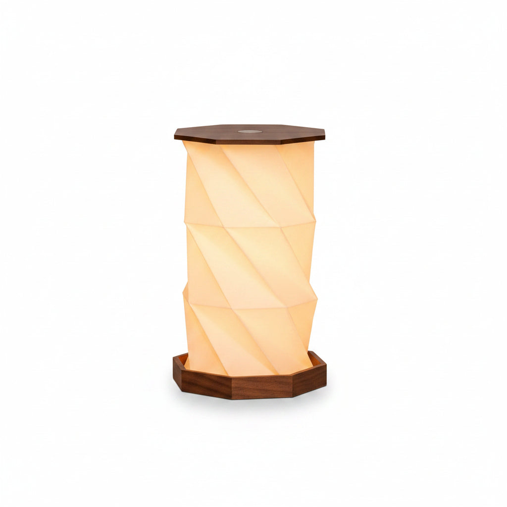 Twist Hexagon lamp walnut finish on round table with hand adjusting top