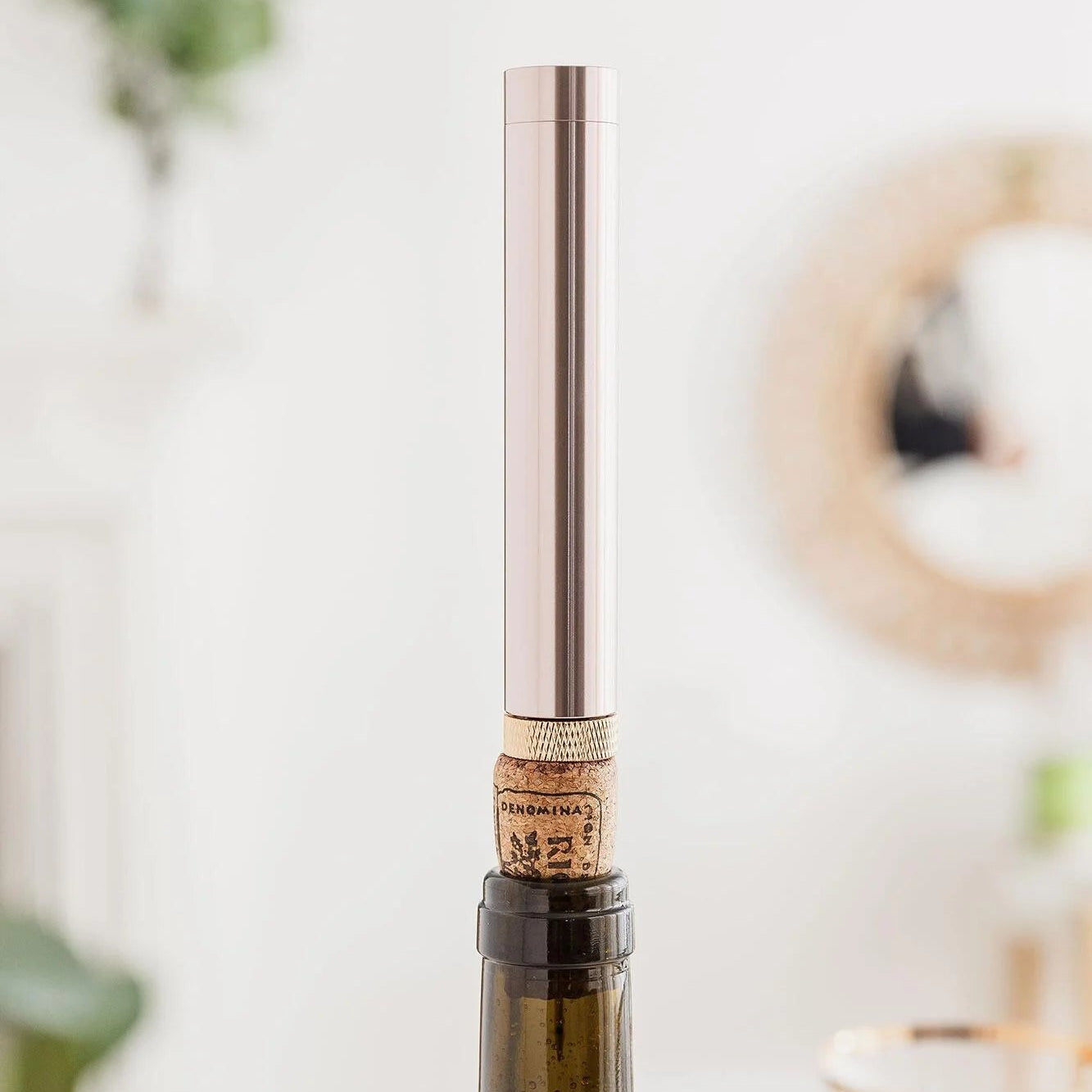 Using air pump wine opener to remove cork
