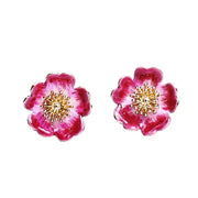Wild Flower Stud Earrings by Bill Skinner featuring hand-painted pink enamel petals and gold centres on white background.