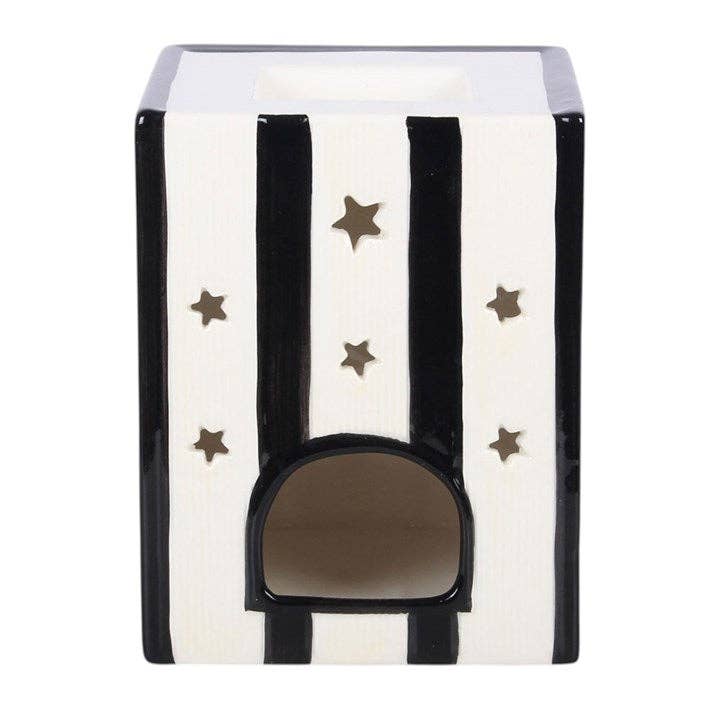 Witch's Apothecary book oil burner in a styled setting