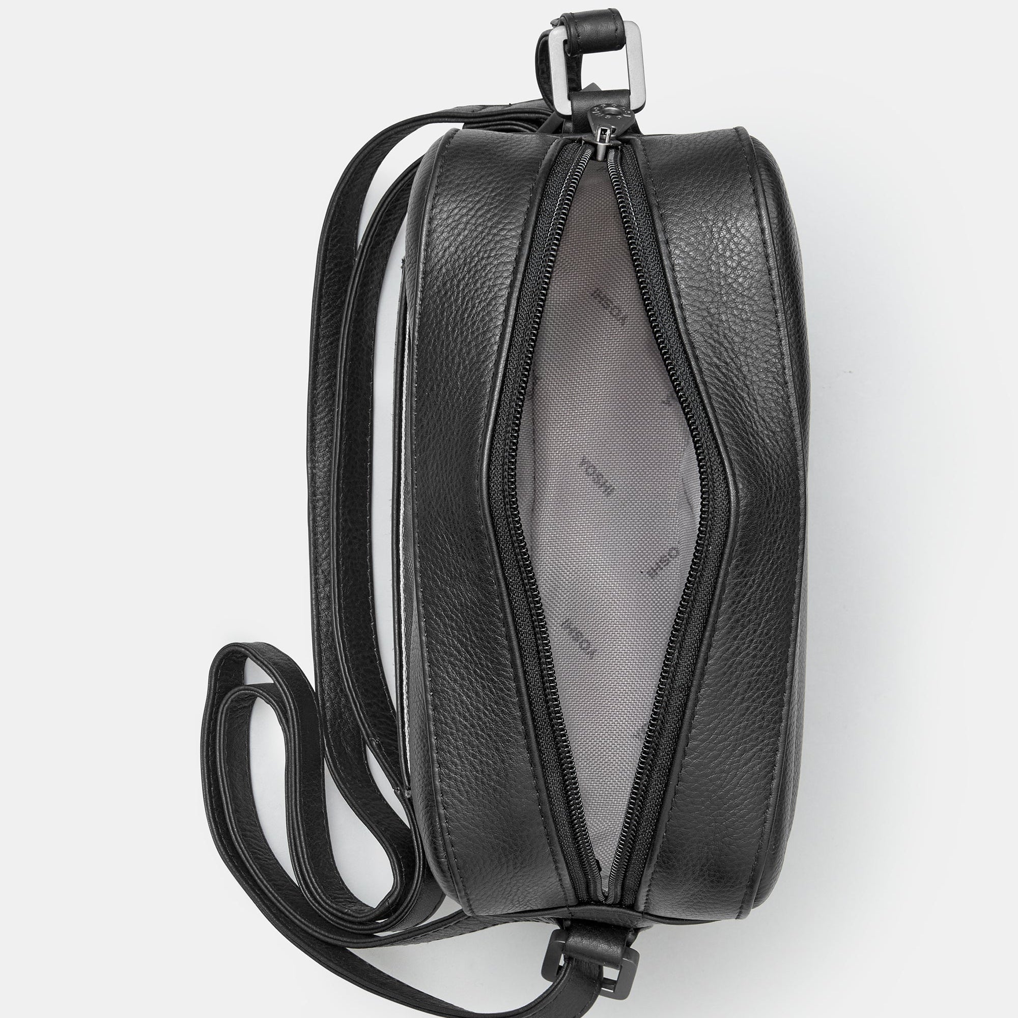 Black leather camera bag overhead flat lay view