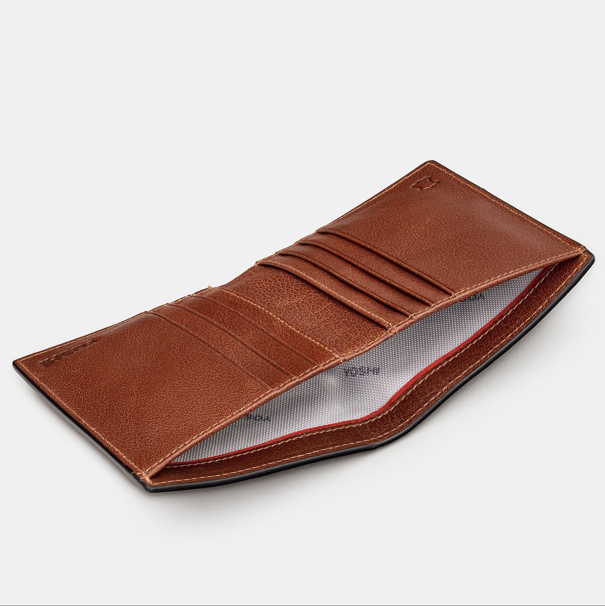 Brown leather wallet angled open view showing card slots and branded lining